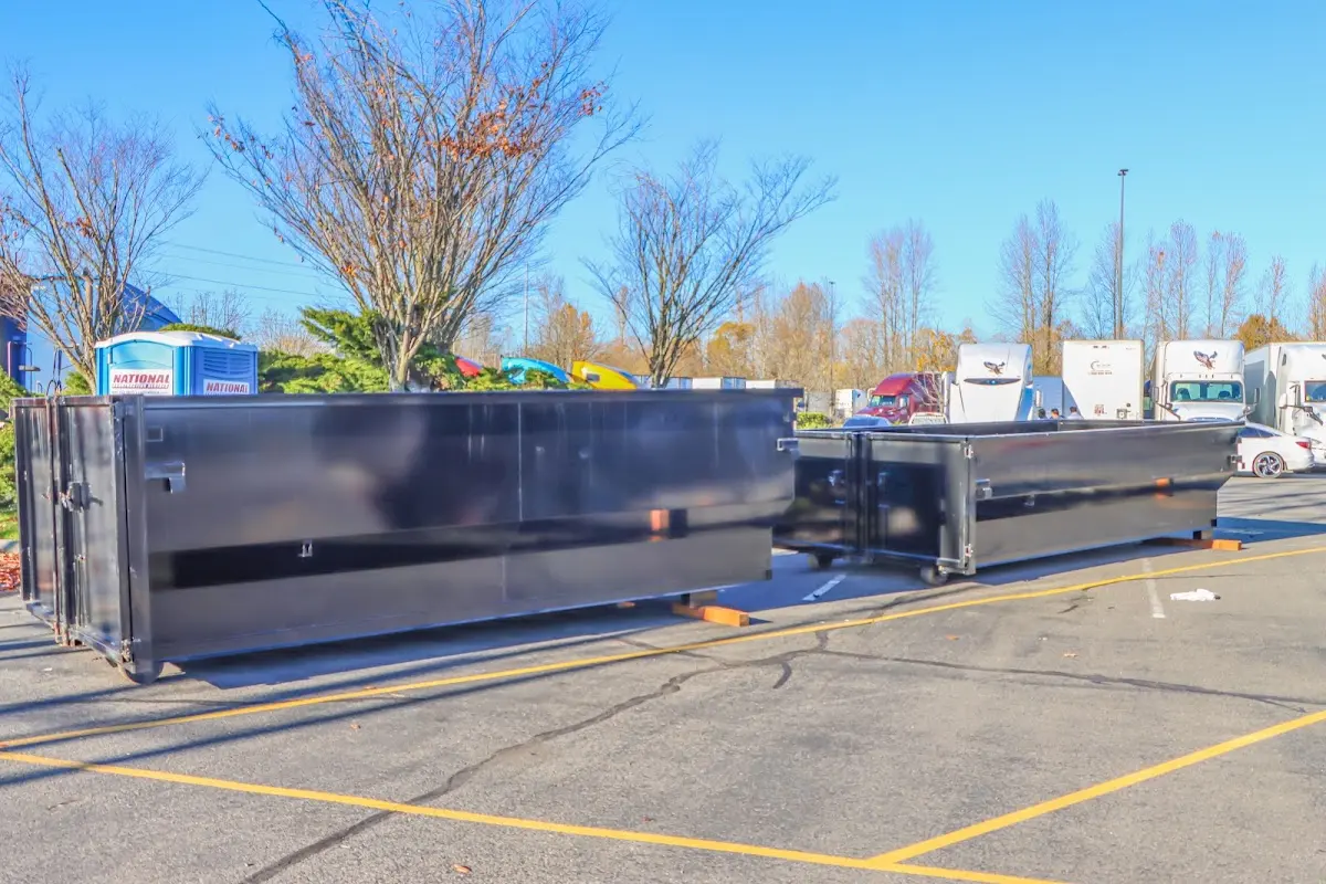 Professional dumpster rental service with roll-off container on residential driveway in Lake Wylie
